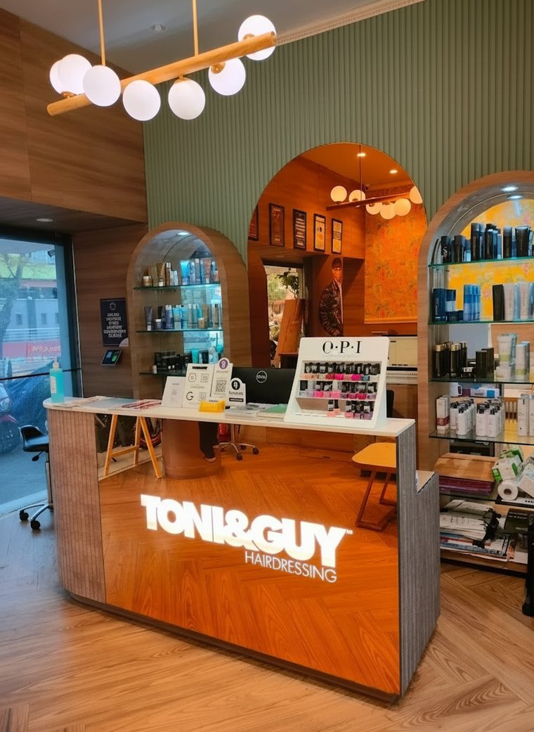 Inside a TONI&GUY salon — reception and retail display